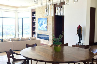 Example of a large trendy great room design in Orange County with beige walls, a stone fireplace and a ribbon fireplace