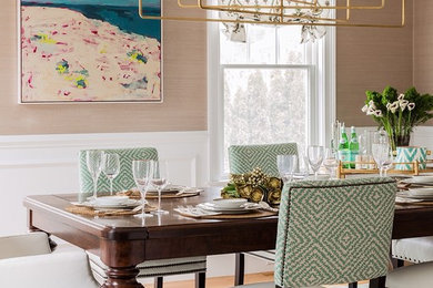 Transitional medium tone wood floor enclosed dining room photo in Boston with beige walls