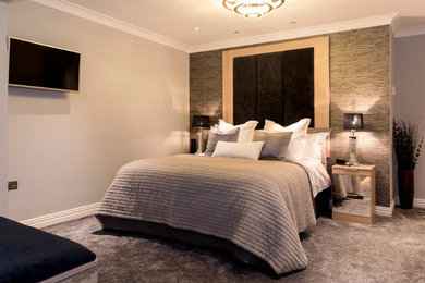 Inspiration for a large modern master bedroom in West Midlands with grey walls, carpet, no fireplace and grey floors.