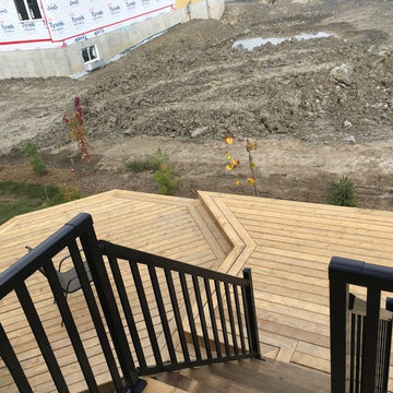 Multiple levels deck with a storage space and a hut-tub place