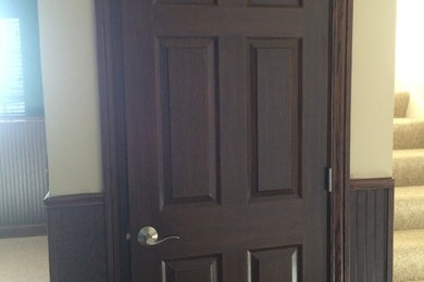 Metal door with a wood grain finish