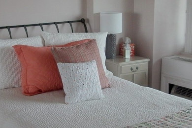 Small transitional master light wood floor bedroom photo in New York with gray walls