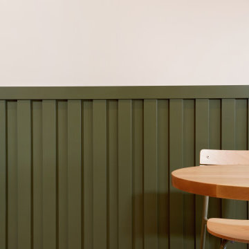 Custom Green Wainscoting in a Modern Coffee Shop