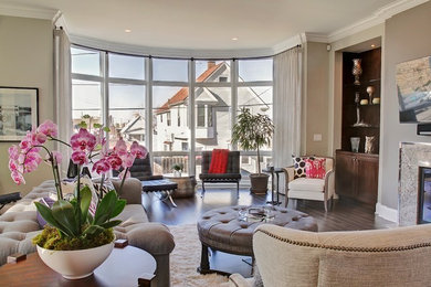 Inspiration for a mid-sized modern open concept dark wood floor living room remodel in Cleveland with beige walls, a standard fireplace, a stone fireplace and a wall-mounted tv