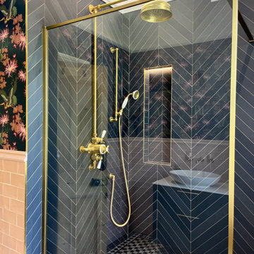 Modern Bathroom with Floral Wallpaper, Brass Fixtures & Blue Vanity