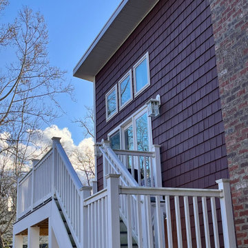 Modern Multi-Level Addition with Shed Roof and Elevated Deck
