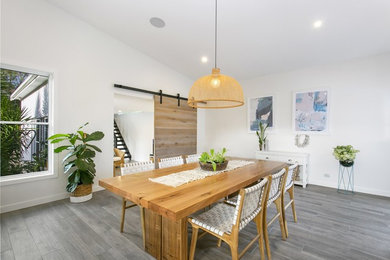 Photo of a beach style dining room in Sydney.