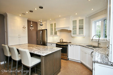 Eat-in kitchen - mid-sized transitional l-shaped medium tone wood floor eat-in kitchen idea in Other with an undermount sink, raised-panel cabinets, white cabinets, granite countertops, white backsplash, porcelain backsplash, stainless steel appliances and a peninsula