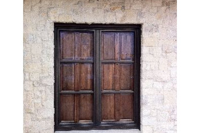 Bronze clad wood windows with interior shutters