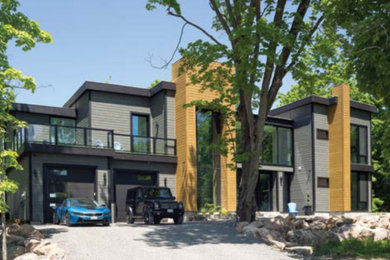 Huge contemporary two-story exterior home idea in Toronto