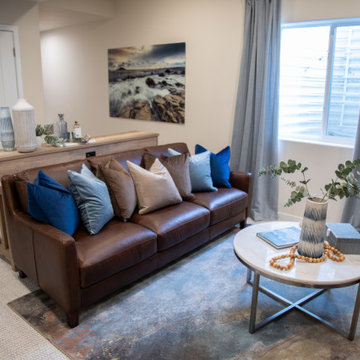 Regent Leather Sofa Anchors a Comfortable Basement Retreat
