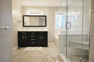 Large transitional master bathroom in Toronto with dark wood cabinets, an undermount tub, a corner shower, white tile, porcelain tile, brown walls, porcelain floors, an undermount sink, engineered quartz benchtops, brown floor and a hinged shower door.