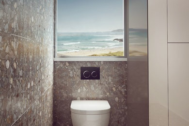 Photo of a contemporary bathroom in Sydney with a wall-mount toilet.