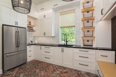Elegant laundry room photo in Orange County