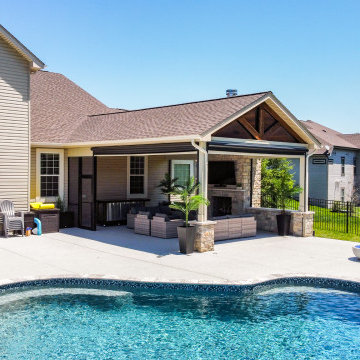 Pool-Side Outdoor Room with a Fireplace and Sitting Walls