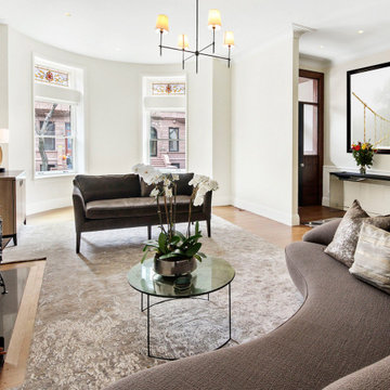 Open Living Room with Fireplace and Curved Sofa