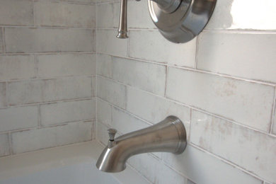 Example of a mid-sized urban kids' white tile and ceramic tile porcelain tile, brown floor and single-sink bathroom design in DC Metro with flat-panel cabinets, gray cabinets, a two-piece toilet, beige walls, an undermount sink, quartz countertops, white countertops and a built-in vanity