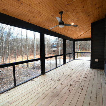 Dramatic screen porch overlooking forest.