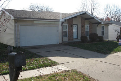 Beige one-story mixed siding exterior home photo in St Louis