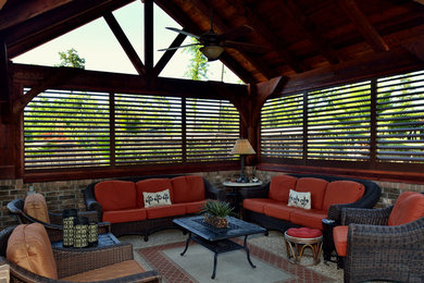 Patio - rustic courtyard concrete patio idea in Houston with a gazebo