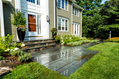Design ideas for a mid-sized traditional front yard stone garden path in Boston.