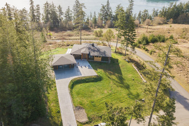 Example of a brown house exterior design in Seattle