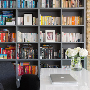 Contemporary study room in London with grey walls, medium hardwood floors, no fireplace and a freestanding desk.