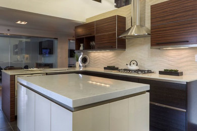 Kitchen - mid-sized contemporary l-shaped porcelain tile kitchen idea in Toronto with an undermount sink, flat-panel cabinets, medium tone wood cabinets, quartz countertops, beige backsplash, stone tile backsplash, stainless steel appliances and an island