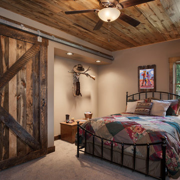 Rustic Timber Frame Home: The Rock Creek Residence - Guest Room with Barn Door