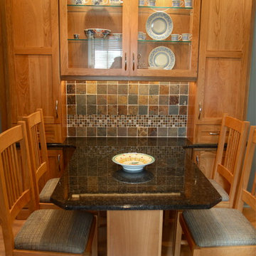 Cohesive Transitional Kitchen | Cherry Cabinets & Black Granite Table