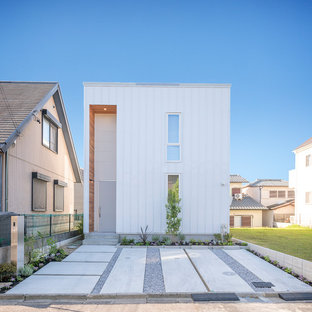 Idéer för ett modernt vitt hus, med två våningar och metallfasad