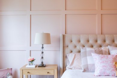 Example of a mid-sized trendy girl wainscoting kids' room design in Austin with pink walls