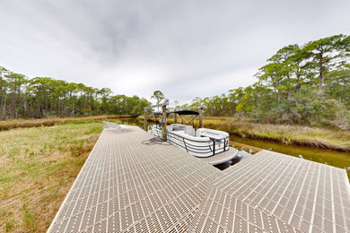 Dock - mid-sized contemporary backyard ground level dock idea in Birmingham with no cover
