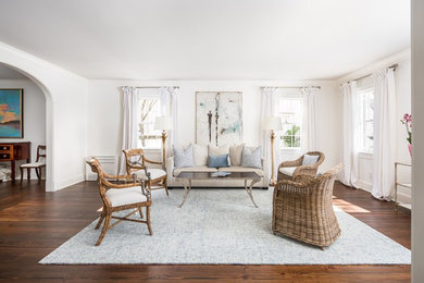 Living room - farmhouse formal and enclosed medium tone wood floor and brown floor living room idea in Charleston with white walls