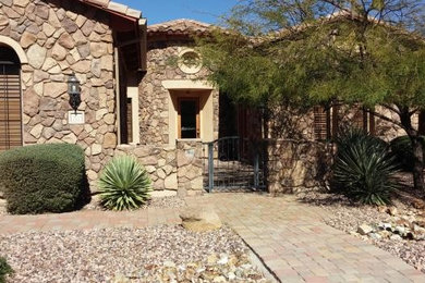 Example of a southwest home design design in Phoenix