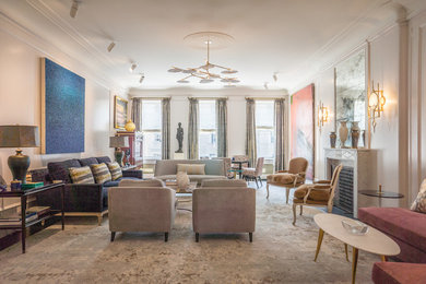 Example of a mid-sized classic formal and enclosed dark wood floor and brown floor living room design in New York with white walls, a standard fireplace, a stone fireplace and no tv