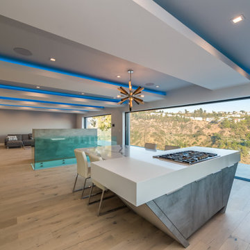 Open Kitchen and Dining Under a Sputnik Chandelier