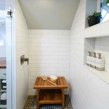 Maximizing Space in a Master Bathroom and Laundry with Light and Materials
