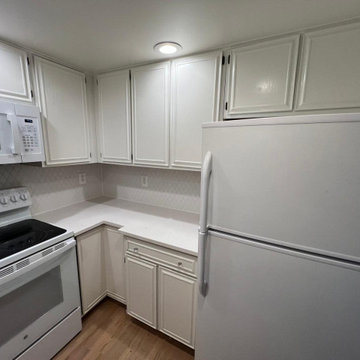 Open-Concept White Kitchen Remodel with Navy Backsplash in Arlington, VA