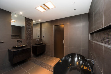 Design ideas for a modern bathroom in Brisbane with a freestanding tub.