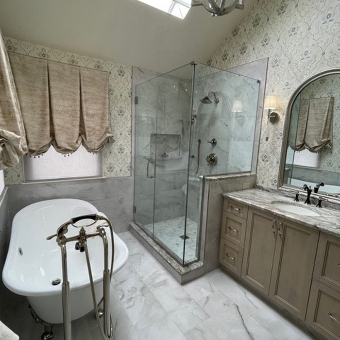 Porcelain floor & wall tile, freestanding sink, custom glass shower, custom window treatment, wallpaper, granite counter top, custom vanity