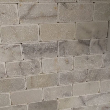 white marble backsplash - before grout