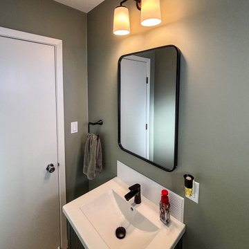 Powder Room with Linear Vintage Green Vanity with White Ceramic Countertop