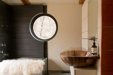 Bathroom - large modern master gray tile and ceramic tile ceramic tile bathroom idea in Other with a vessel sink, furniture-like cabinets, light wood cabinets, wood countertops and a wall-mount toilet