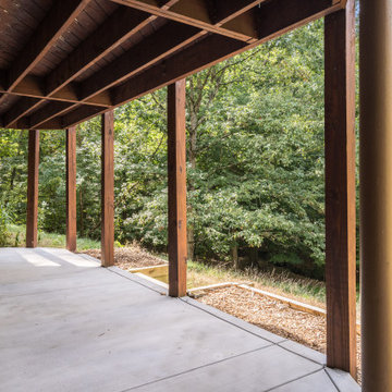 Expansive Covered Patio with Concrete Slab and Wood Columns