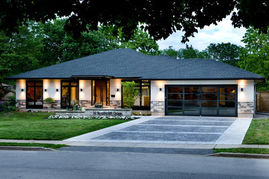 Mid-sized modern home design in Toronto.