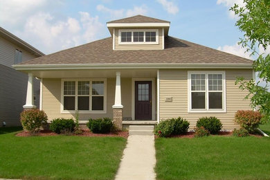 Small elegant beige one-story vinyl house exterior photo in Bridgeport with a hip roof and a shingle roof