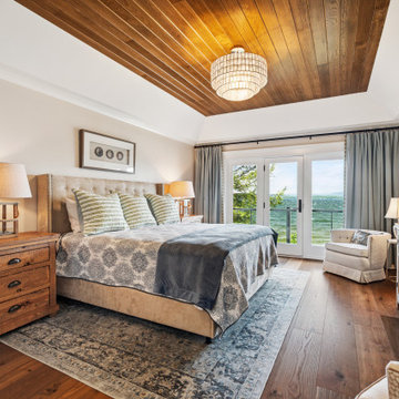 Lakeview Primary Bedroom with Wood Ceiling and Neutral Tones