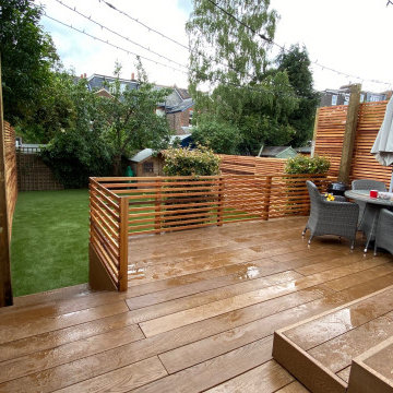 Millboard deck, artificial grass and cedar slat fencing in Reigate