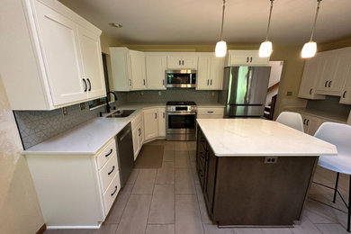 Mid-sized transitional u-shaped eat-in kitchen photo in Other with shaker cabinets, quartz countertops and an island
